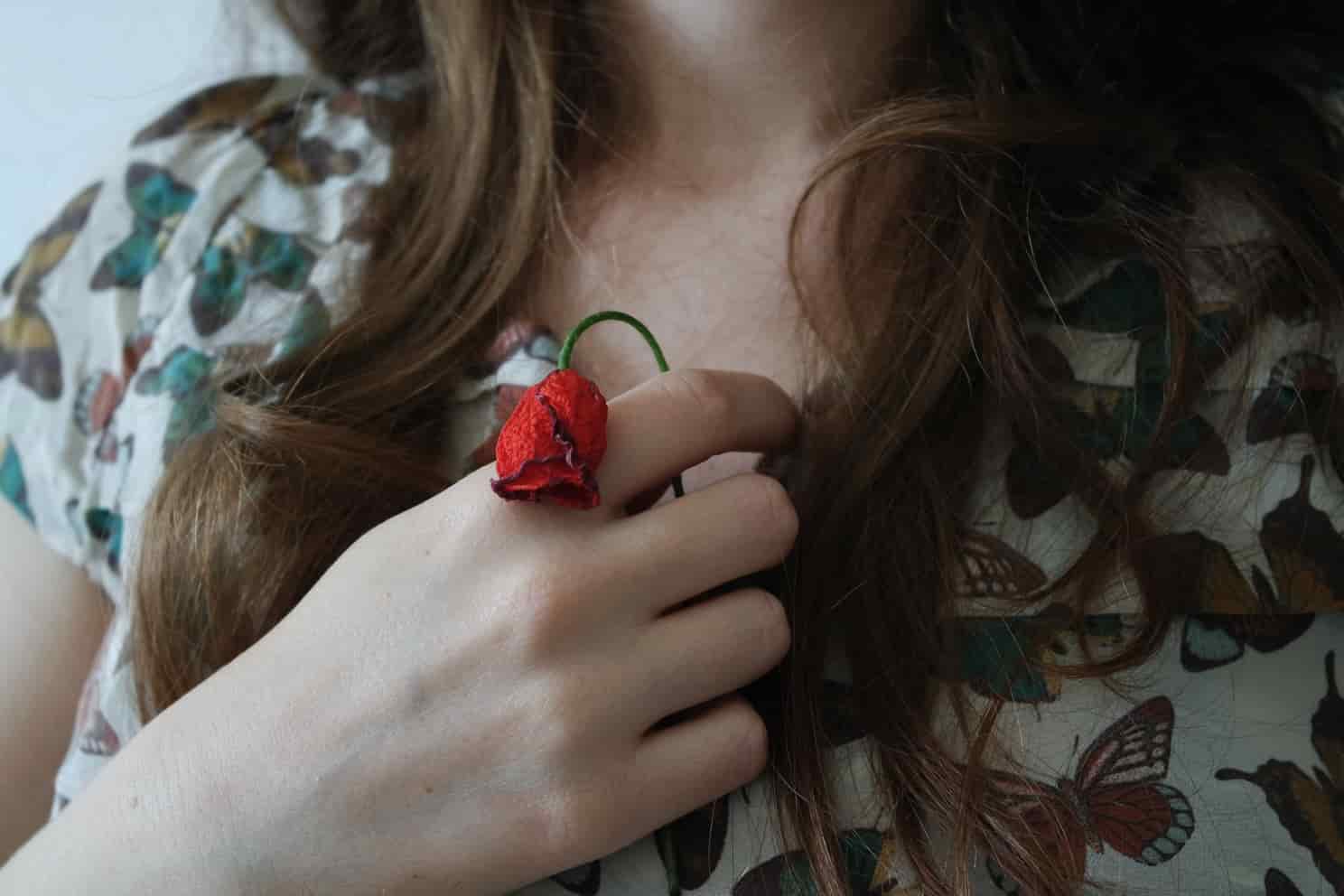 Wilted rose in hand