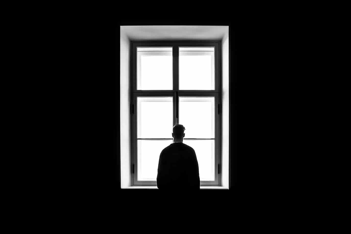 Man alone by window