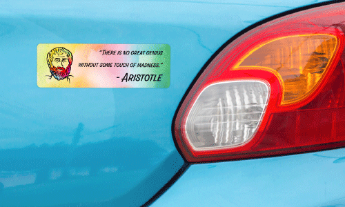 Back bumper of blue sedan. There is a rainbow patterned bumper sticker with a graphic of Aristotle. The text says There is no Great Genius without Madness - Aristotle.