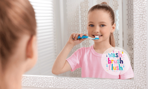 Happy little girl brushing her teeth thanks to her reminder bathroom stickers