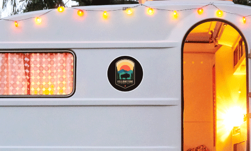 Colorful sticker on the back of a white RV