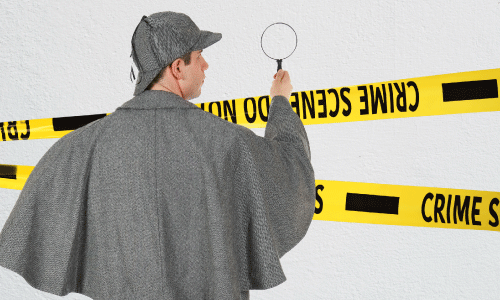 Sherlock Holmes using magnifying glass on a painted wall